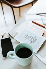 Stack of books and a coffee