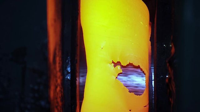 ellow Hot Copper Slab Moving in Shaping Machine on Metal Production Industrial Line Close Up