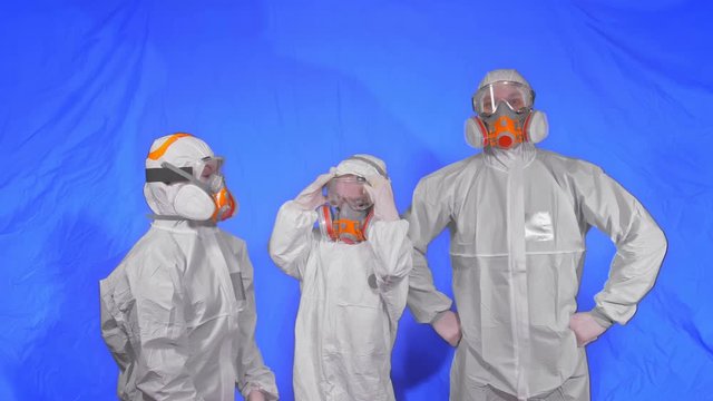 The family shield protect, to save life from virus. Slow motion. People portrait, wearing protect medical aerosol spray paint mask respirator. Concept health safety protection coronavirus epidemic.