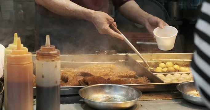 Hong Kong Street Food - Chinese Woman serving Y&uacute; W&aacute;n Fish Balls and  Chicken