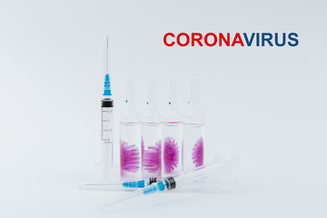 Syringes and ampoules with a vaccine against the virus covid-19.