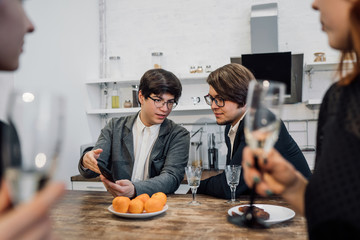 Handsome business people talking in office kitchen