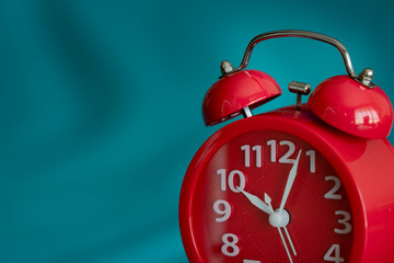 Closeup on clockwise. Face of red Alarm clock at 10 O'clock