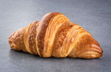 Croissant on a gray background.