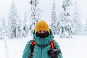 Fototapeta na wymiar Landscape photographer in a snowy forest