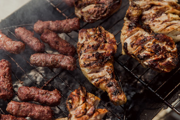 meat on the grill.
grilled kebabs with chicken drumsticks.