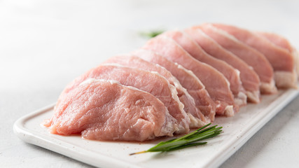 Fresh meat with spieces for cooking on white background, side view, close up. Cooking, raw ingredients