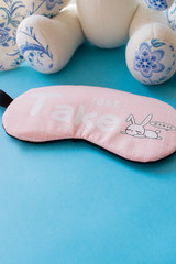 sleep mask on a blue background
