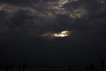 A shot of dramatic cloudscape and beach silhouette