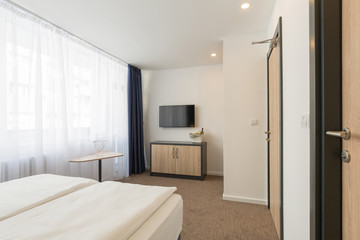 Naklejka na ściany i meble Interior of a double bed hotel room interior