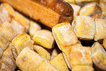  Bunch of sliced French breads and sandwiches in a basket. 