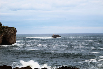 waves crashing on rocks