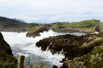 waves crashing on rocks