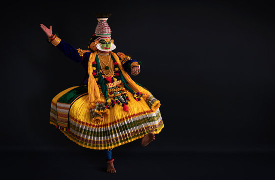 Kathakali dancer dancing.
