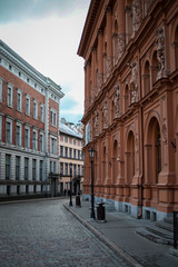 Fototapeta na wymiar Beautiful Riga city architecture with old buildings and brick streets.