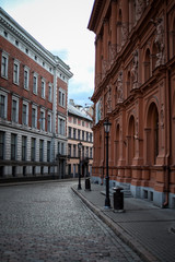 Beautiful Riga city architecture with old buildings and brick streets.