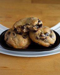 Soft and chewy chocolate chip cookies on a wooden table