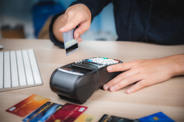 Fototapeta premium business paying with credit card machine, client purchase payment concept