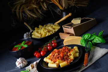 Rigatoni pasta with Bolognese sauce and fresh basil
