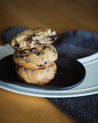 Soft and chewy chocolate chip cookies on a wooden table