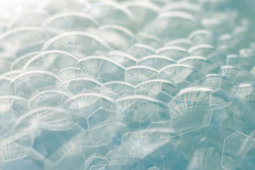 Obraz premium Pile of light blue soap bubbles with a gradient from white to light blue, use as background or tutorial to wash your hands 
