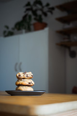 Soft and chewy chocolate chip cookies on a wooden table