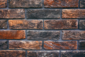 Textured stylish brick wall background. Decorative abstract design. Ancient brickwork.
