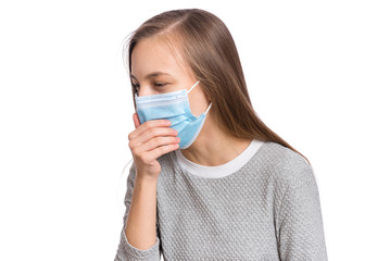 Concept of coronavirus quarantine. Sick Child wearing medical protective face mask is coughing. COVID-19. Teen girl with coronavirus symptom or respiratory tract infection isolated on white background