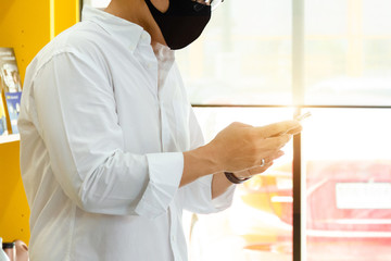 Close-up image of male wearing white shirt hands using smartphone at meeting room for searching or social networks concept and Communicate with colleagues when working online.