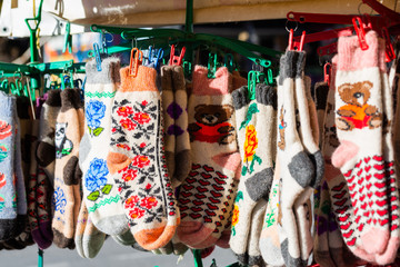 Traditional knitted socks as rural souvenirs on street market