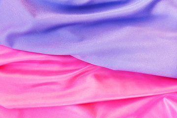 Smooth elegant pink and lilac silk or satin texture. Luxurious backdrop design