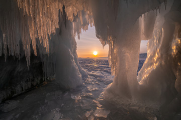 Ice cave of Lake Baikal at sunset