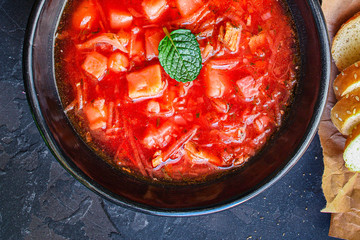 red tomato soup and vegetables and meat, borsch cuisine menu concept keto or paleo diet background. top view. copy space for text