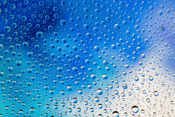 Naklejka na ściany i meble Drops texture. Wet water on glass background. Bubble pattern.