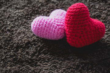 abstract Red and Pink Heart Knitting in the hand for valentine 's day. Love concept. 