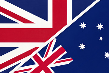 United Kingdom vs Australia national flag from textile. Relationship between two European and Oceania countries.