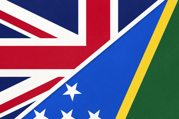 United Kingdom vs Solomon Islands national flag from textile. Relationship between two European and Oceania countries.