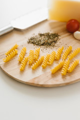 Variety of types and shapes of Italian pasta in rows on white background. Italian cuisine food. Dry pasta background texture.