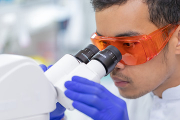 Picture of Scientist using a microscope in a laboratory, Concept science and Technology , Science...