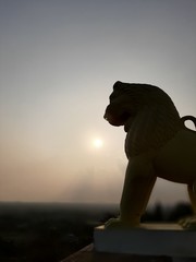 Fototapeta na wymiar lion statue at sunset