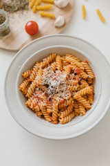 italian homemade pasta with tomato sauce and parmesan