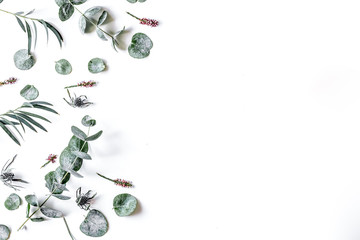 floral concept with green leaves on white background top view mock-up