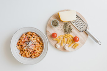 italian homemade pasta with tomato sauce and parmesan
