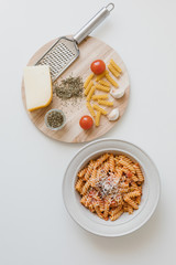 italian homemade pasta with tomato sauce and parmesan