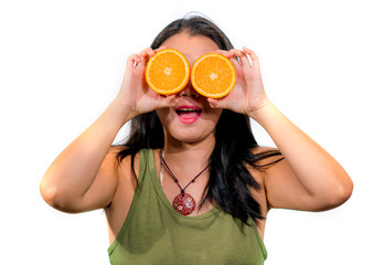 young beautiful and happy Asian Chinese woman holding orange fruit smiling playful isolated on white background in healthy natural nutrition and diet concept