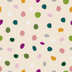 Vector seamless pattern with spots. Cream background.