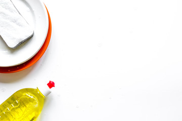 concept of washing dishes on white background top view