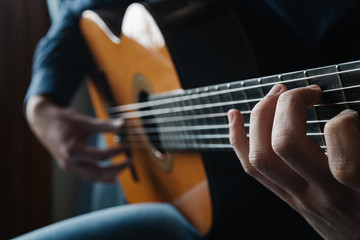 Obraz na płótnie Canvas guitarist. Man playing acoustic guitar