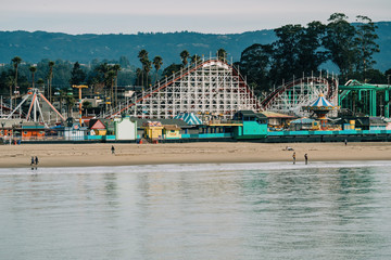 Fototapeta na wymiar Beach boardwalk with an amusement park taken in Santa Cruz, CA