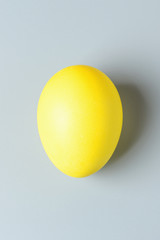 Yellow Easter egg close-up. Easter eggs background. Easter eggs are a symbol and a mandatory attribute of the holiday.